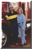 Earl and Debbie Peterson stand proudly near their Peterbilt 379 showtruck, Kersplat